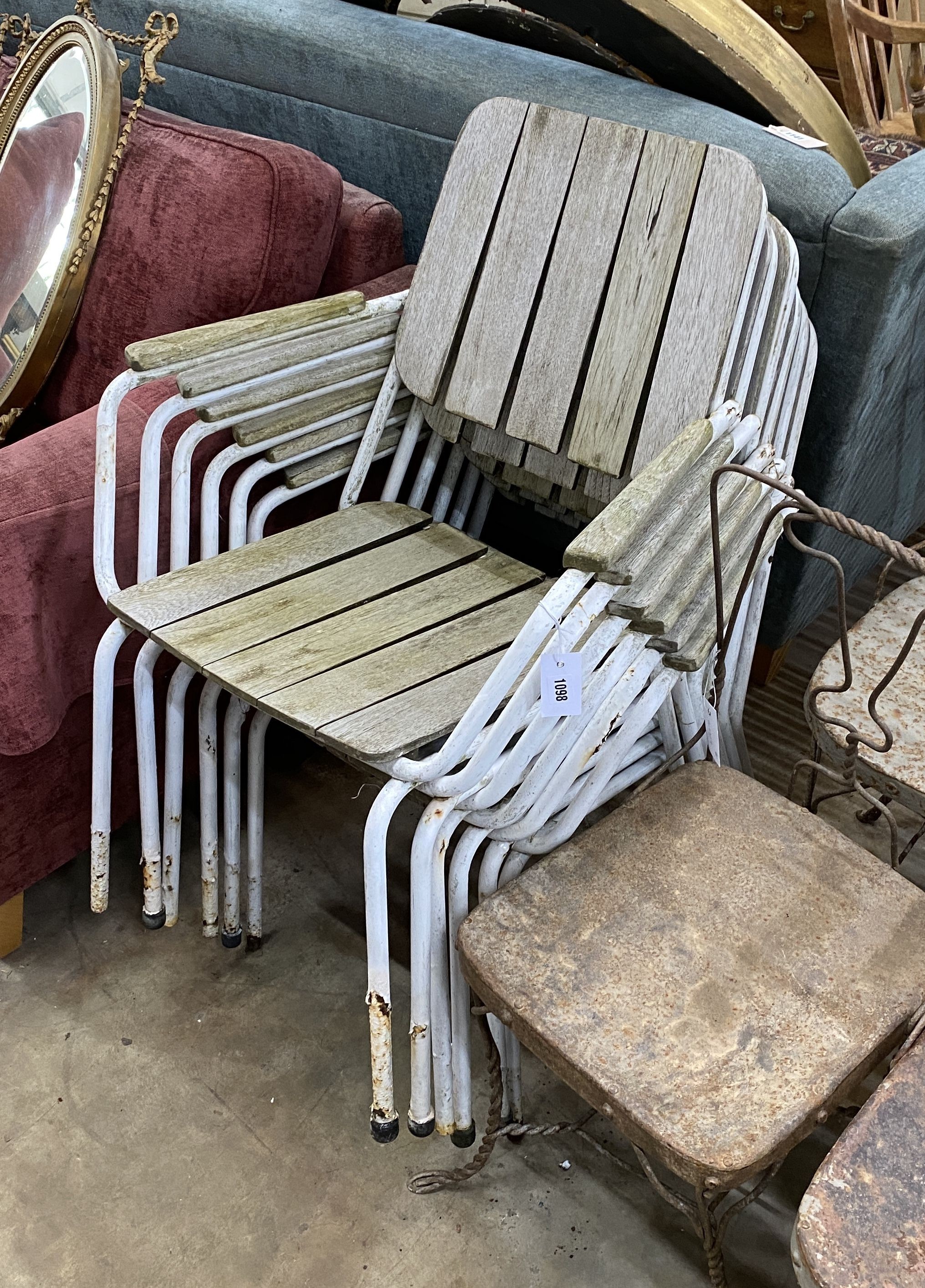 A set of six weathered teak and wrought iron stacking garden chairs, width 61cm, depth 54cm, height 80cm